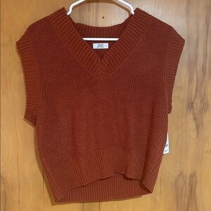 Ardene rust-colored chunky V-neck knit vest.